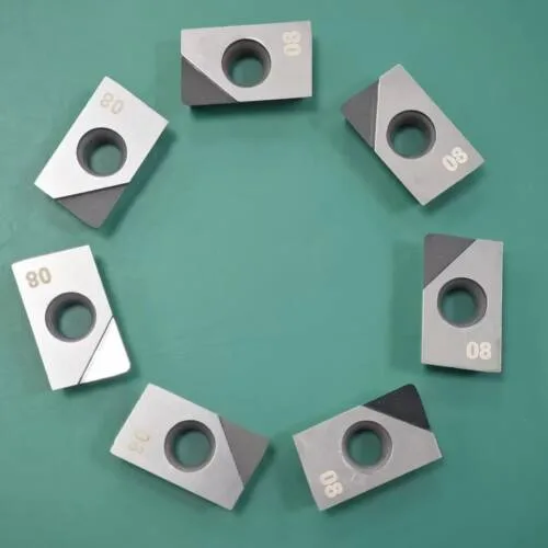 PCD inserts APKT160408 arranged on a green inspection surface