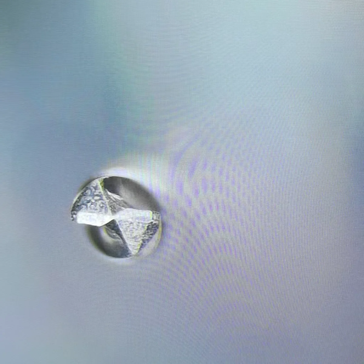 Magnified end view of a solid PCD micro drill during inspection
