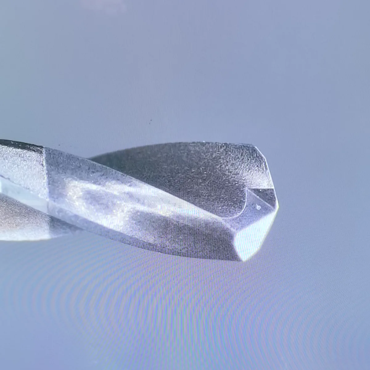 Magnified side view of a solid PCD micro drill cutting edge during inspection